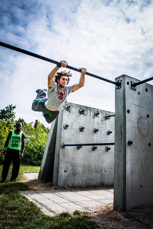 Men jumping in grey sweatpants. Baggy Motion Pants - Grey